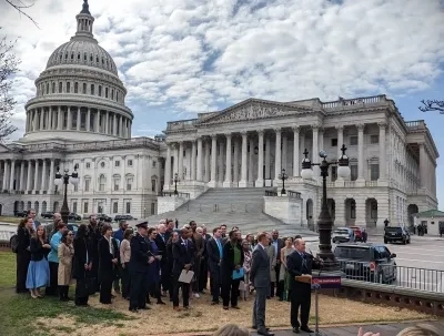FOTH 2023 Participants Standing Behind Sens. Lankford and Coons at a Press Conference for the Charitable Act
