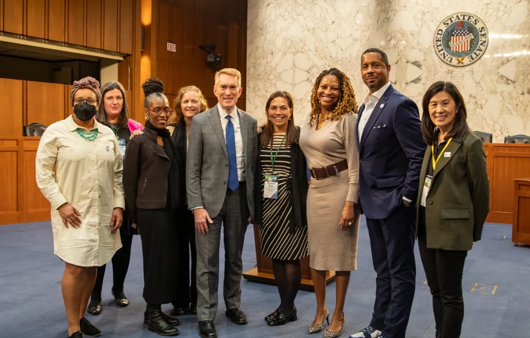 Forum Staff and members join Sen. James Lankford for a picture in the US Senate